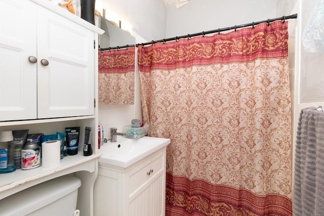 bathroom with vanity and toilet