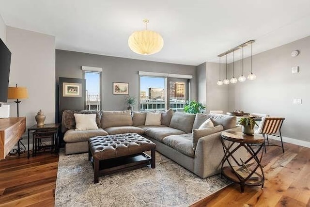 living room with wood finished floors and baseboards