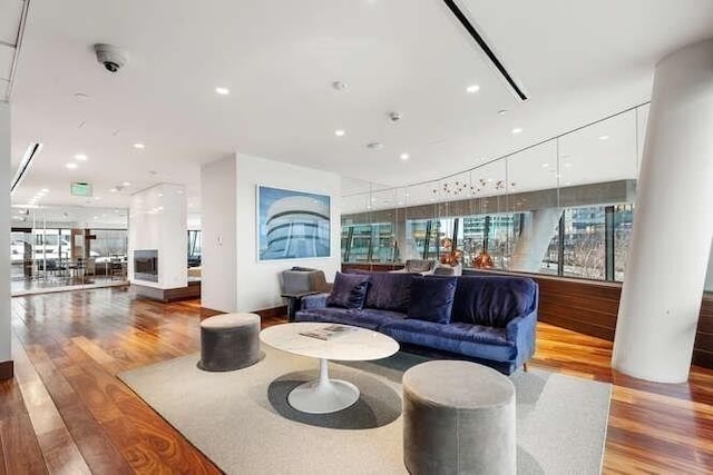 living room with recessed lighting and light wood-style floors