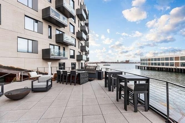 view of patio featuring a water view