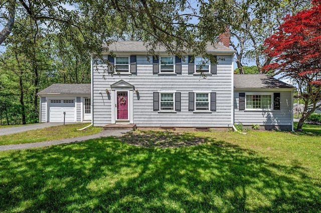 146 Elm St, Andover, MA 01810 - colonial home featuring an attached garage, a chimney, a front yard, asphalt driveway, and roof with shingles