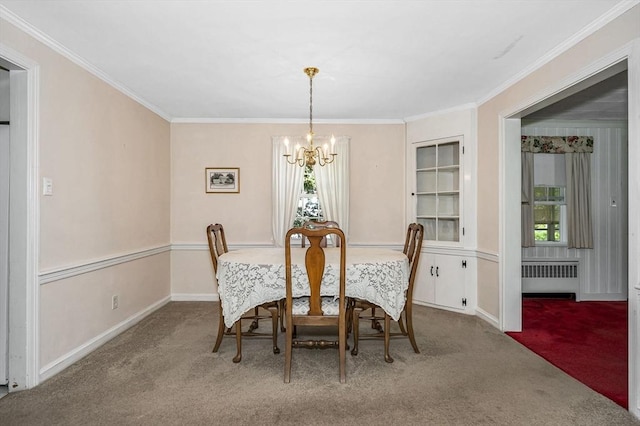 146 Elm St, Andover, MA 01810 - carpeted dining area with radiator, a chandelier, ornamental molding, and baseboards