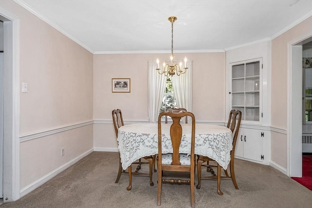 146 Elm St, Andover, MA 01810 - carpeted dining area with a chandelier, radiator, ornamental molding, and baseboards