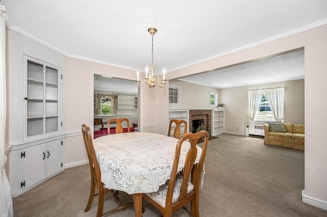 146 Elm St, Andover, MA 01810 - dining area featuring a chandelier, light colored carpet, ornamental molding, baseboards, and built in features