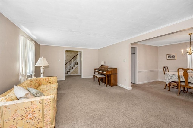 146 Elm St, Andover, MA 01810 - living room with carpet floors, stairs, a chandelier, ornamental molding, and baseboards