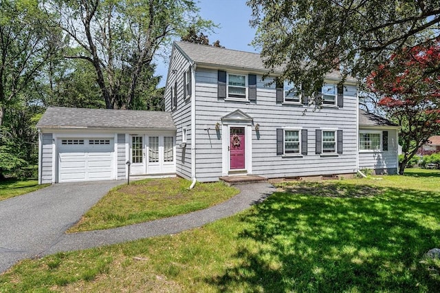 146 Elm St, Andover, MA 01810 - colonial-style house featuring an attached garage, a front yard, driveway, and roof with shingles