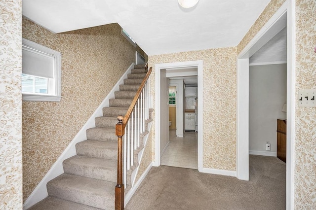 146 Elm St, Andover, MA 01810 - stairs with wallpapered walls, carpet floors, and baseboards