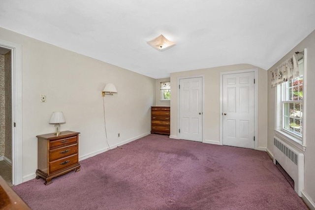 146 Elm St, Andover, MA 01810 - unfurnished bedroom with radiator, carpet flooring, baseboards, and two closets