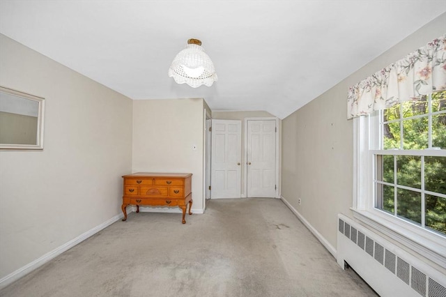 146 Elm St, Andover, MA 01810 - spare room with radiator, baseboards, healthy amount of natural light, light carpet, and vaulted ceiling