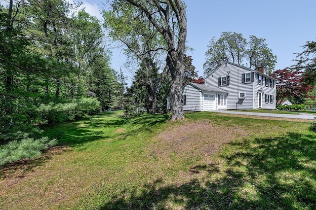 146 Elm St, Andover, MA 01810 - view of property exterior with a chimney and a lawn