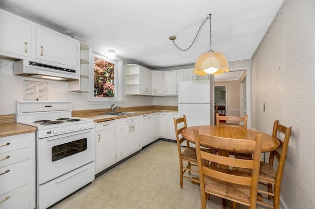 146 Elm St, Andover, MA 01810 - kitchen with white appliances, under cabinet range hood, open shelves, wallpapered walls, and light floors