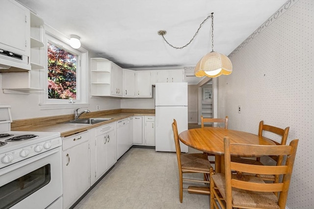 146 Elm St, Andover, MA 01810 - kitchen with white appliances, open shelves, a sink, wallpapered walls, and white cabinets
