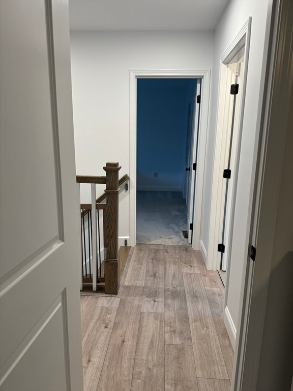 corridor featuring light hardwood / wood-style flooring