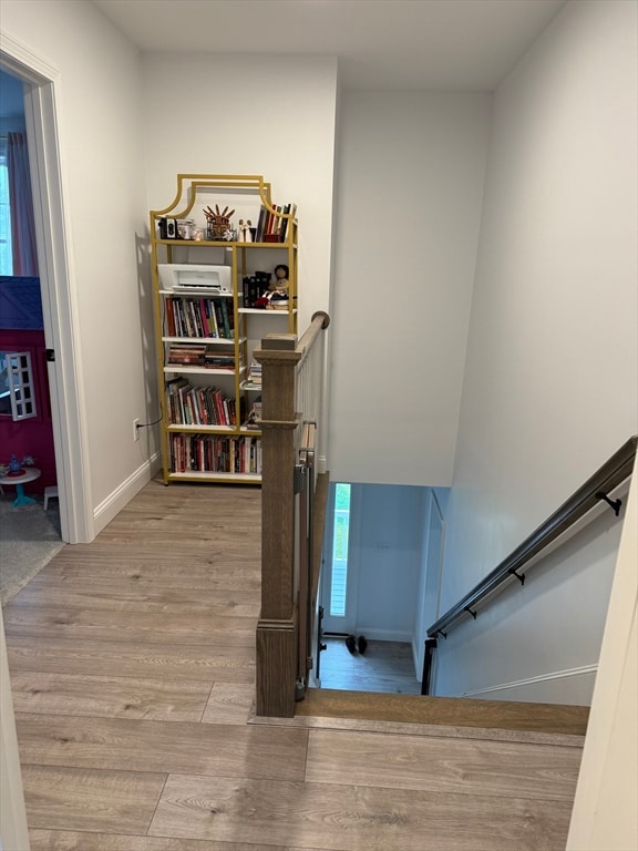 stairway with wood-type flooring