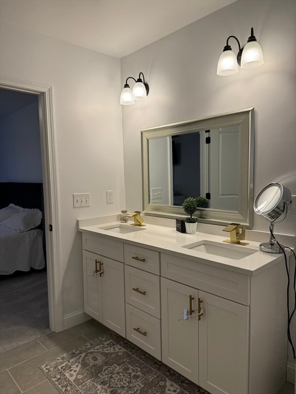 bathroom featuring tile patterned flooring and vanity