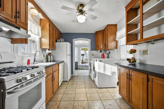 kitchen with a textured ceiling, white appliances, ceiling fan, and light tile patterned flooring