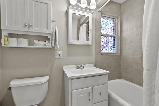 full bathroom featuring vanity, toilet, and shower / tub combo