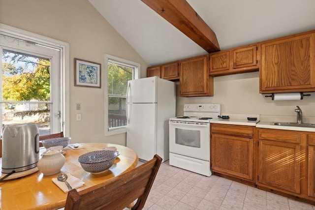 kitchen featuring a sink, white appliances, vaulted ceiling with beams, brown cabinetry, and light countertops