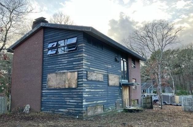 view of property exterior featuring a chimney