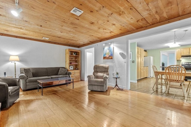 187 Middle Rd, Southborough, MA 01772 - living area with wooden ceiling, light wood-style flooring, and baseboards