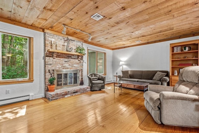 187 Middle Rd, Southborough, MA 01772 - living area featuring wood ceiling, a baseboard radiator, hardwood / wood-style floors, a brick fireplace, and baseboard heating