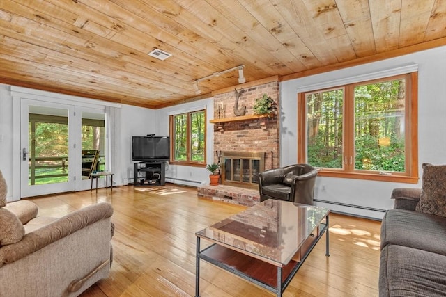 187 Middle Rd, Southborough, MA 01772 - living area featuring a baseboard heating unit, a baseboard radiator, wood ceiling, hardwood / wood-style floors, and healthy amount of natural light