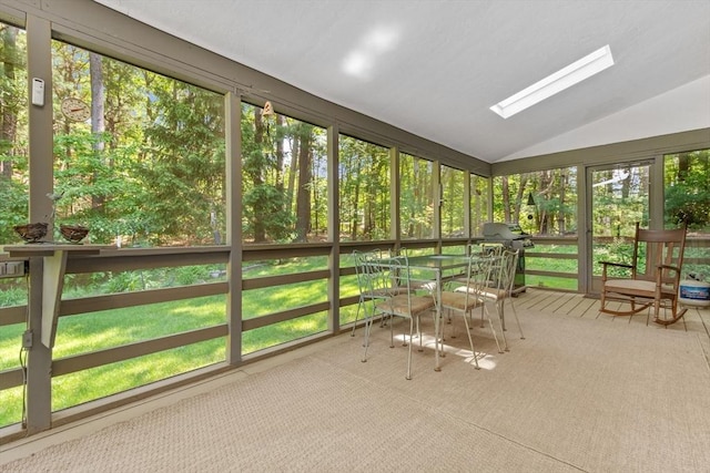 187 Middle Rd, Southborough, MA 01772 - unfurnished sunroom with vaulted ceiling, a skylight, and outdoor dining area