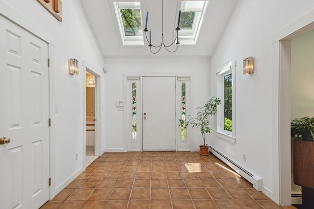 187 Middle Rd, Southborough, MA 01772 - foyer featuring a baseboard heating unit, a skylight, lofted ceiling, a chandelier, and a baseboard radiator