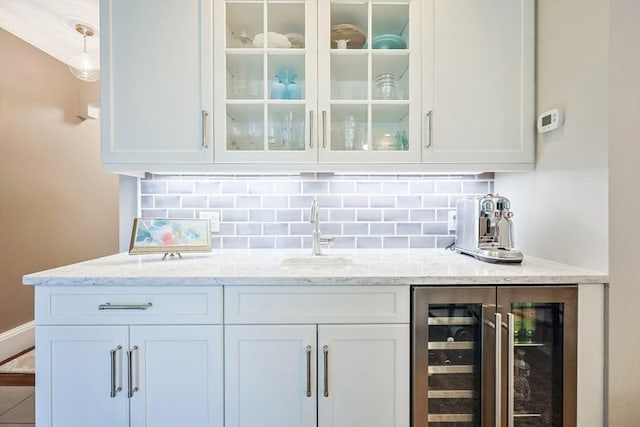 indoor wet bar with wine cooler and decorative backsplash