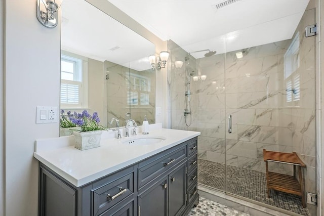 bathroom with vanity and a stall shower