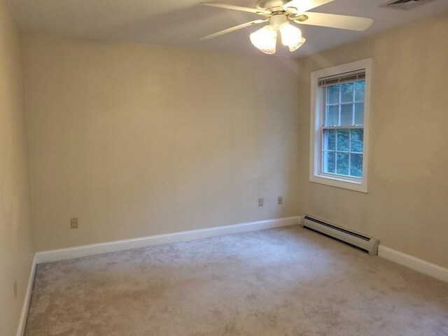 unfurnished room featuring carpet, baseboards, a baseboard heating unit, and ceiling fan