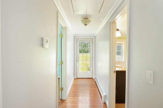 64 Charlotte White Rd Unit 2, Westport, MA 02790 - hall featuring a baseboard heating unit, attic access, ornamental molding, and light wood finished floors