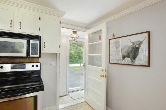 64 Charlotte White Rd Unit 2, Westport, MA 02790 - kitchen featuring stainless steel electric range, white cabinetry, and ornamental molding