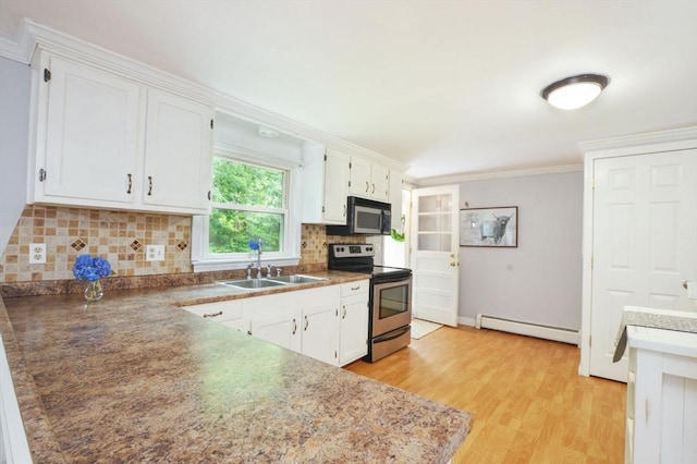 64 Charlotte White Rd Unit 2, Westport, MA 02790 - kitchen with electric stove, a baseboard radiator, white cabinetry, tasteful backsplash, and light wood-type flooring
