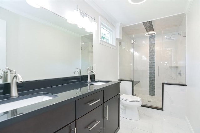 bathroom featuring vanity, crown molding, a shower with shower door, and toilet