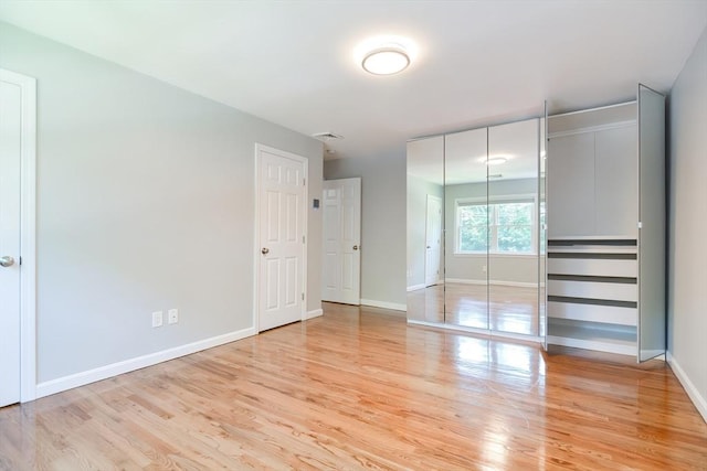 unfurnished bedroom with light hardwood / wood-style floors