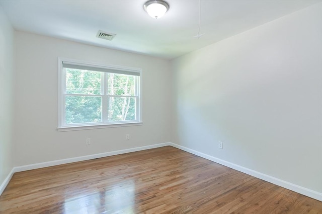 spare room with light wood-type flooring