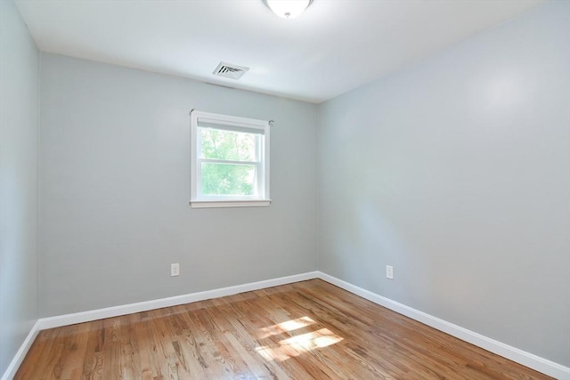 unfurnished room featuring light hardwood / wood-style floors