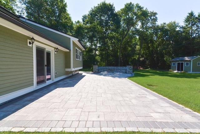 view of patio with a storage shed