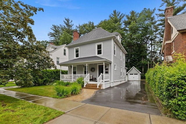 60 Roseland Ter, Longmeadow, MA 01106 - american foursquare style home with covered porch, an outbuilding, a garage, a chimney, and a front yard