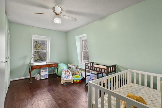 bedroom with a ceiling fan, baseboards, and hardwood / wood-style floors