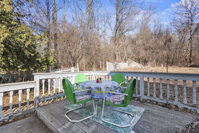 wooden terrace with outdoor dining area