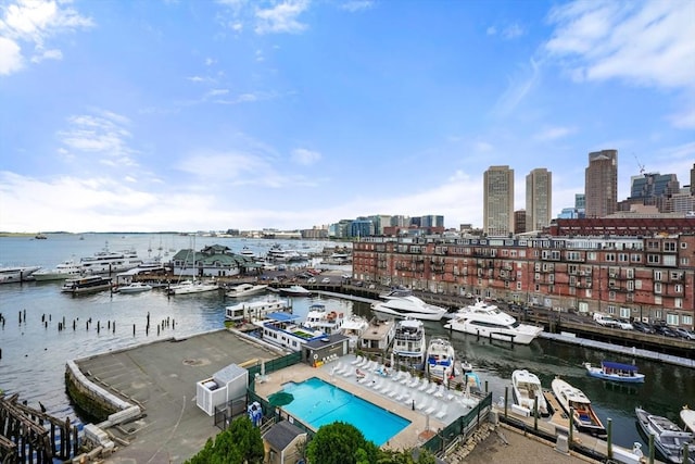 view of urban area with a marina and a nearby body of water