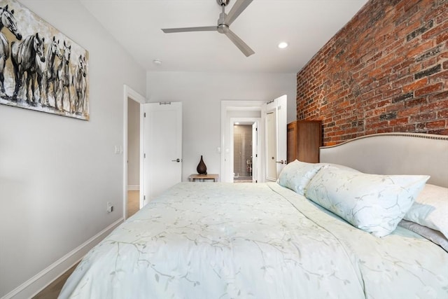 bedroom with brick wall, baseboards, ceiling fan, and recessed lighting