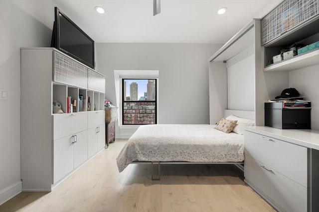 bedroom featuring light wood-style flooring, baseboards, and recessed lighting