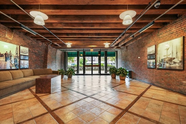 common area featuring brick wall