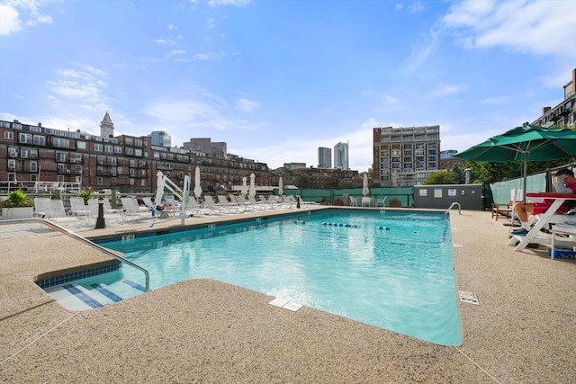 community pool with a patio area
