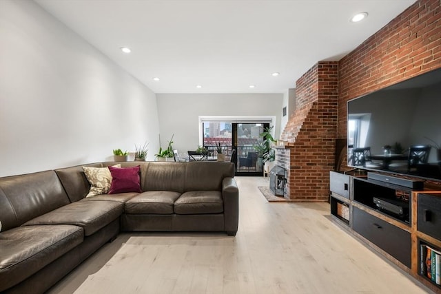 living area featuring light wood-style floors and recessed lighting