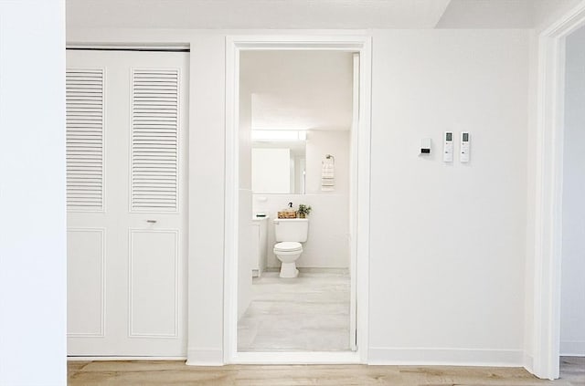 585 Revere Beach Pkwy Unit 410, Revere, MA 02151 - corridor featuring wood finished floors and baseboards
