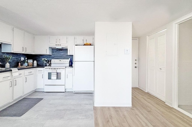585 Revere Beach Pkwy Unit 410, Revere, MA 02151 - kitchen featuring white appliances, under cabinet range hood, backsplash, and white cabinets